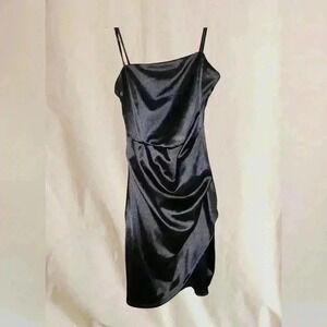 Spaghetti strap, black mini cocktail dress.